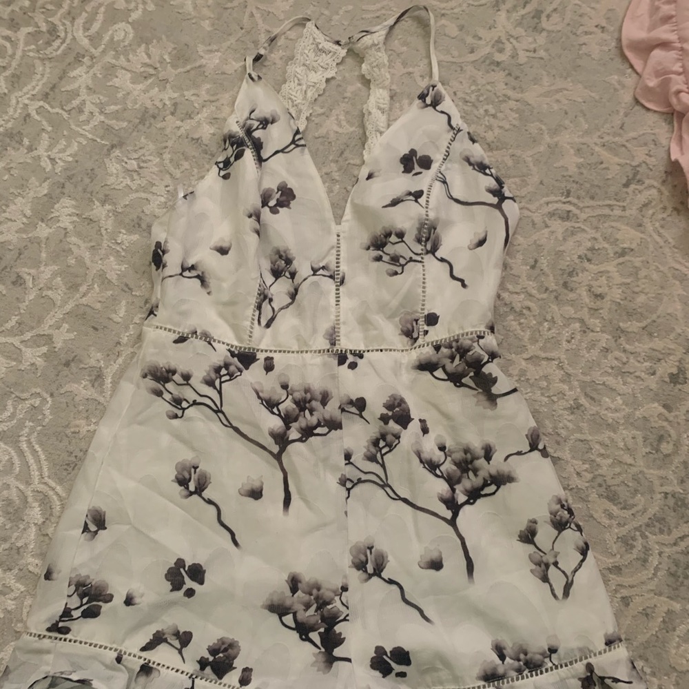 White romper with gray flowers